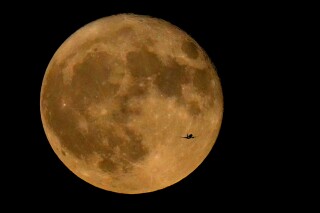 Two supermoons in August mean double the stargazing fun | AP News
